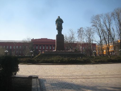 Taras Shevchenko University, behind a statue of the Ukrainian poet; flowers at the base celebrate his 200th birthday on March 9.