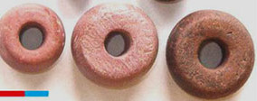 Ovruch slate spindle whorls, used for trade during the coinless period